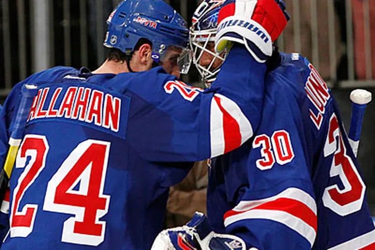 Rangers goaltender Henrik Lundqvist (right) stopped 21 shots for his fifth career playoff shutout. (Kathy Willens/AP)