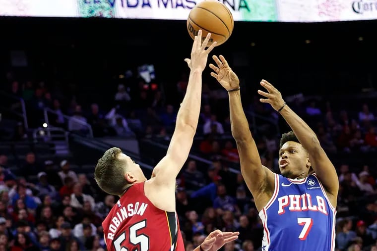 Sixers Kyle Lowry shoots over Heat Duncan Robinson during the 1st quarter at the Wells Fargo Center in Philadelphia, Monday, March 18, 2024.