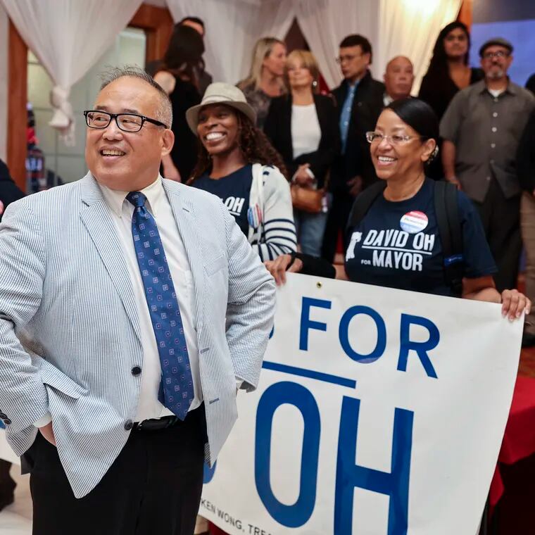 Republican mayoral candidate David Oh gathers attendees on stage for a group photo during a campaign event at Grand Palace Restaurant in Philadelphia, Pa. on Monday, Sept. 25, 2023. Oh will face Democratic candidate Cherelle Parker in the mayoral election on November 7.