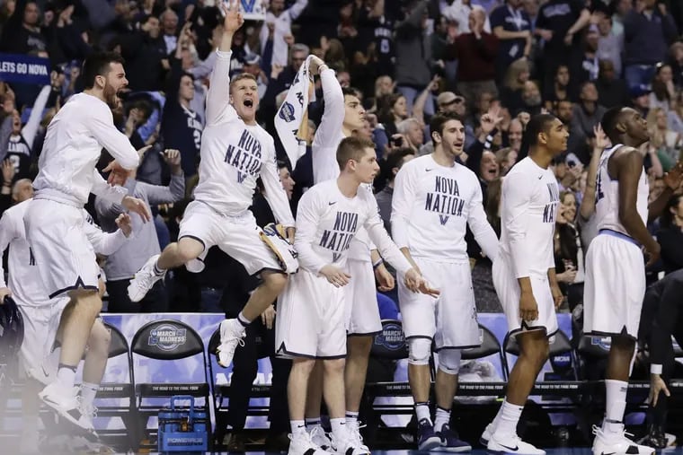 The Villanova bench celebrate after teammate guard Phil Booth made a three-point basket against West Virginia during the second half in the East Regional Sweet 16 on Friday, March 23, 2018 at the TD Garden in Boston.