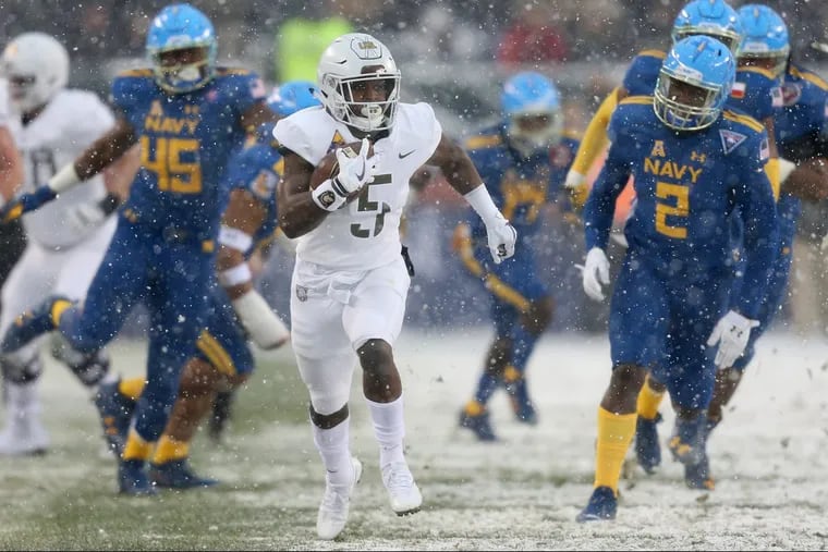 Army running back Kell Walker (5) runs the ball during the annual Army-Navy football game at Lincoln Financial Field on Saturday, Dec. 9, 2017.