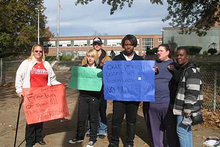 From left: Linda Moskowitz, her daughter Jennifer, Rae-Evelyn Cruel, Obeccah Glass-Murphy and Stephanie Cruel protest the new uniform policy in front of Northeast High School. (Olivia Biagi / Staff)