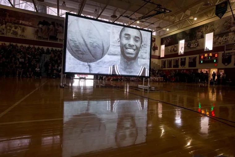 A video tribute to Kobe Bryant is played during a ceremony at Lower Merion High School.