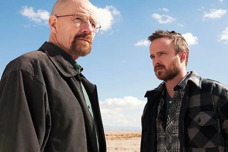 This image released by AMC shows Bryan Cranston as Walter White, left, and Aaron Paul as Jesse Pinkman in a scene from "Breaking Bad."  (AP Photo/AMC, Frank Ockenfels )