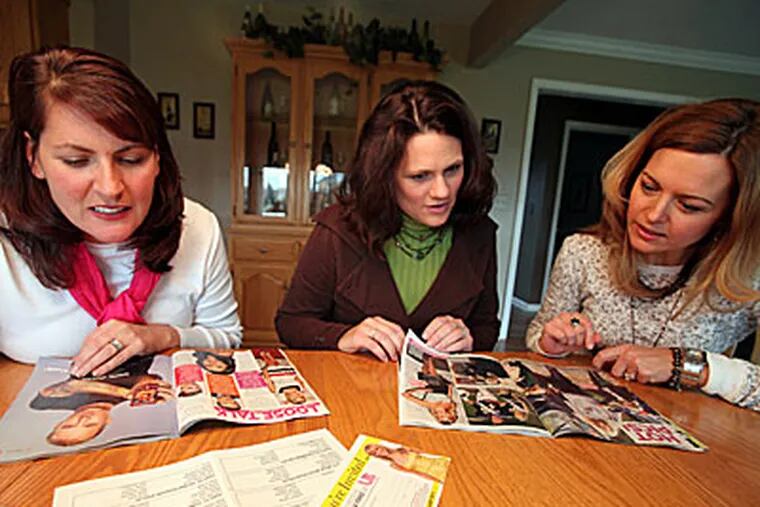 From left to right, Mandy MacNeil, 37, Kristin Durand, 34, and Mary Klott, 36, all players of US Weekly Fantasy League, peruse the pages of US Weekly to find out if their picks are in the magazine and count their points. Their league is similar to fantasy football; they just pick entertainment stars as their team members. (Regina H. Boone / Detroit Free Press / MCT)