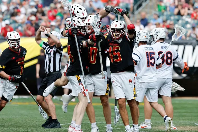 Maryland defender Colin Burlace (center) celebrates his second-quarter goal with his teammates against Virginia in the second semifinal of the NCAA men's lacrosse championships at Lincoln Financial Field on Saturday.