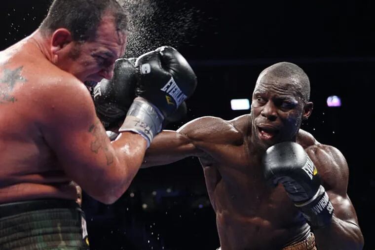 Steve Cunningham (right) lands a punch on Jason Gavern during the fourth round of a heavyweight boxing match at the Prudential Center in Newark, N.J. on Saturday, Sept. 8, 2012. Cunningham won by unanimous decision in 10 rounds. (Tim Larsen/AP file)