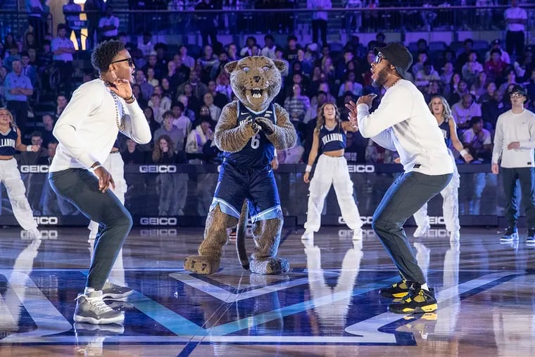 Jordan Longino (left) and Justin Moore take part in a team dance number during Hoops Mania on Saturday. On Tuesday, many coaches in the Big East said they liked the Wildcats chances of going dancin' yet again come March.