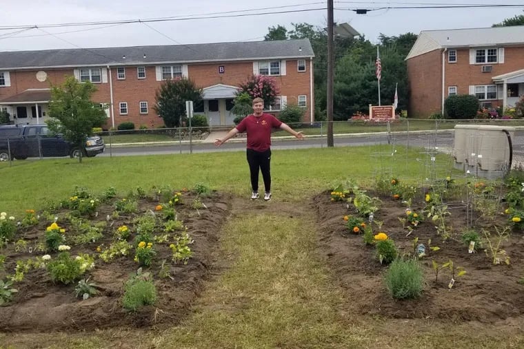 Jacob Rodriguez stands in the community garden he helped plant in the formerly empty lot at the corner of Whittaker & Stokes in Riverside, New Jersey. The goal of his Eagle Scout project was to help feed the community, but also unite it, by providing something they could do together.