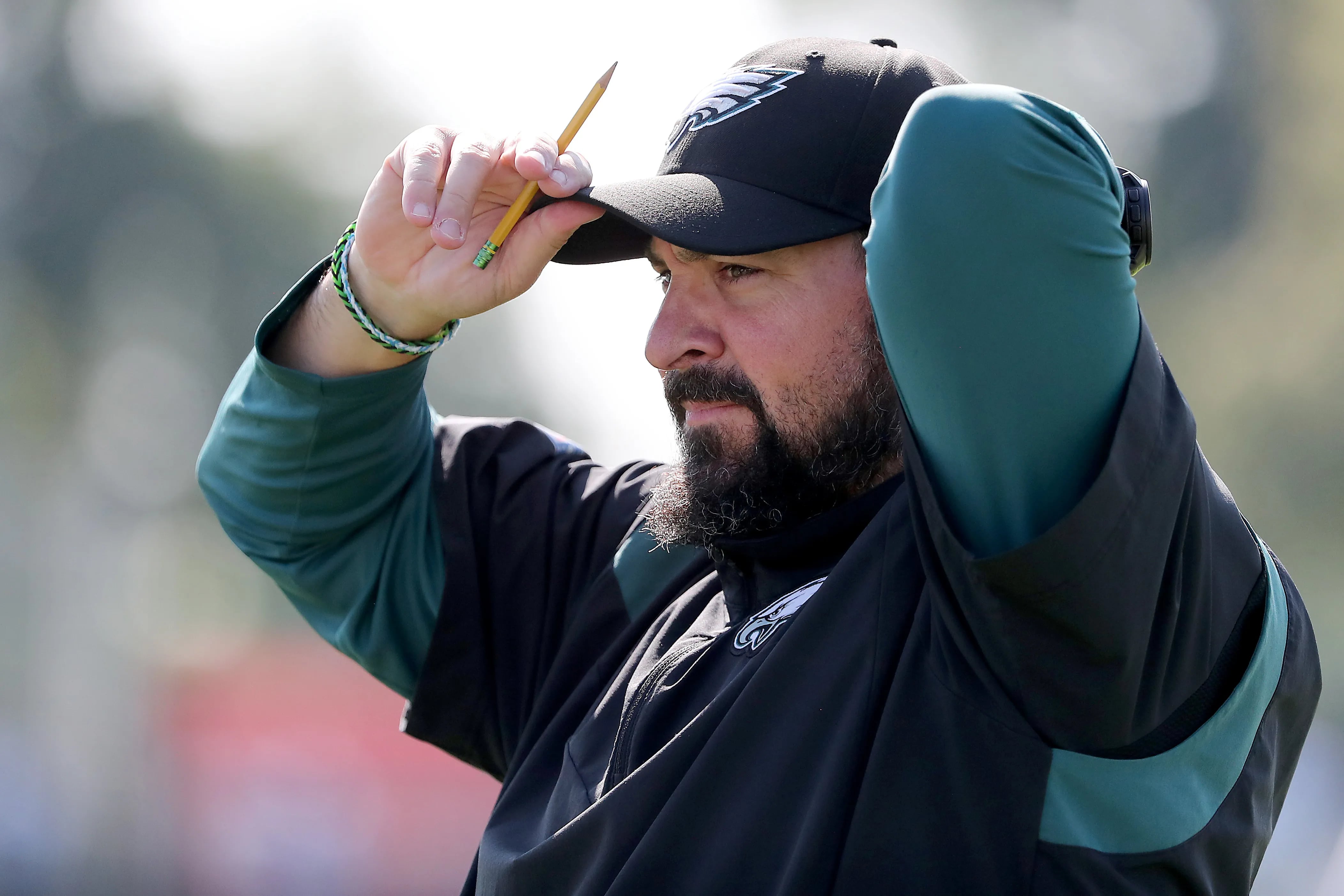 Eagles defensive assistant coach Matt Patricia adjusts his cap during practice at the NovaCare facility in Philadelphia, Pa. on Sunday, Aug. 20, 2023.
