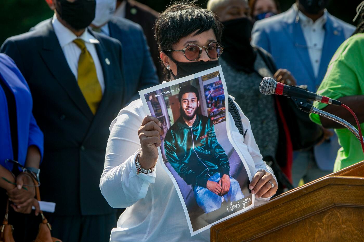 Tamika Morales holds up a picture of her son Ahmad Morales who was shot and killed in Point Breeze in July.