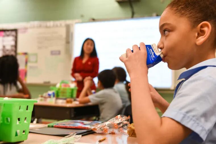 Deliah eats breakfast as Councilwoman Helen Gym speaks to a fourth-grade class at H.A. Brown Elementary School in Kensington on Wednesday to mark national School Breakfast week.