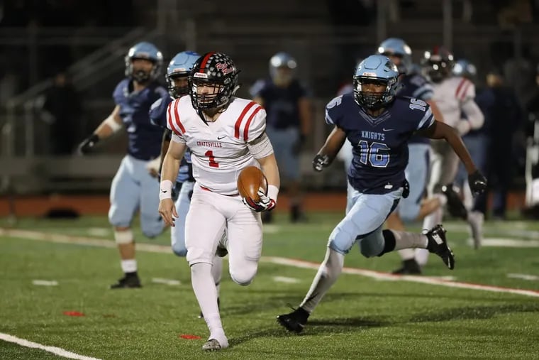 Coatesville quarterback Ricky Ortega (1) runs for a 47-yard score in a 42-13 win over North Penn in Friday night's PIAA District 1 Class 6A quarterfinal playoff.