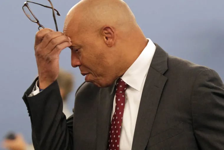Superintendent of The School District of Philadelphia William Hite scratches his head while arriving to a public meeting to adopt a operating budget for 2014/2015 at the Philadelphia School District Building on Monday, June 30, 2014.  ( YONG KIM / Staff Photographer )
