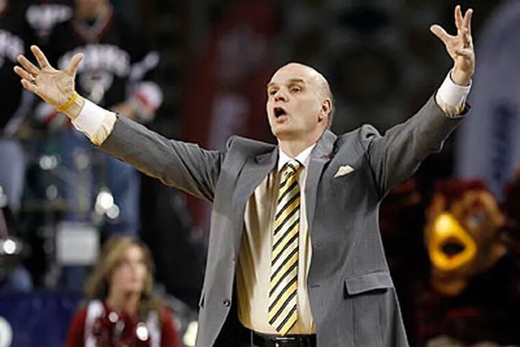 Ed Rendell gave Phil Martelli and the St. Joe's Hawks a B for this season. (Yong Kim/Staff Photographer)
