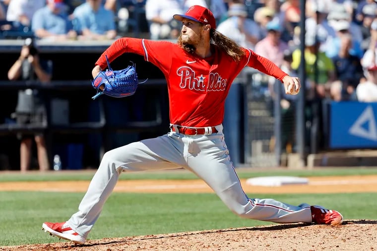 Phillies pitcher Matt Strahm throws the baseball during a spring training game.