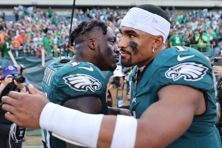 Eagles wide receiver A.J. Brown (left) and quarterback Jalen Hurts, one of the NFL's top tandems, have been in the news for the wrong reasons the last few weeks.