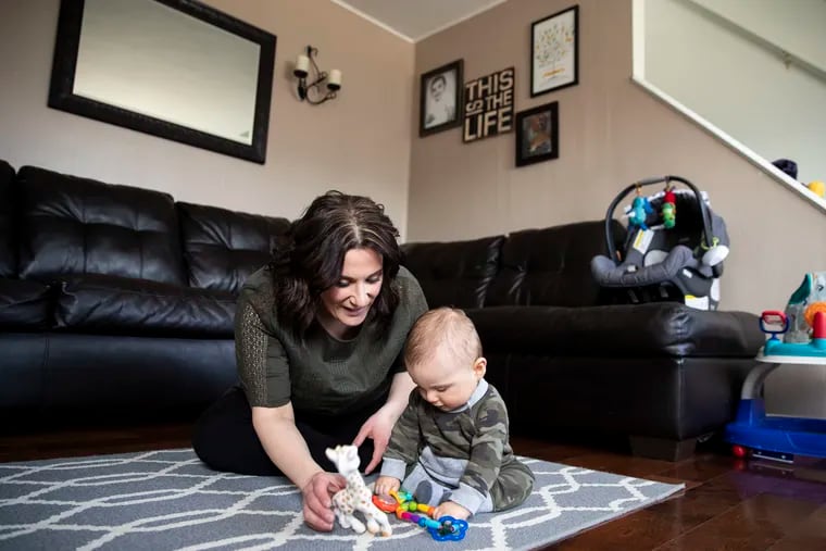Jennifer Mendez, 36, with her son Max, 8 months, at their home in Burlington. Jennifer Mendez is part of the "sandwich generation," people who are responsible for raising their children and caring for aging family members. Her 79-year-old grandmother has chronic obstructive pulmonary disease (COPD).