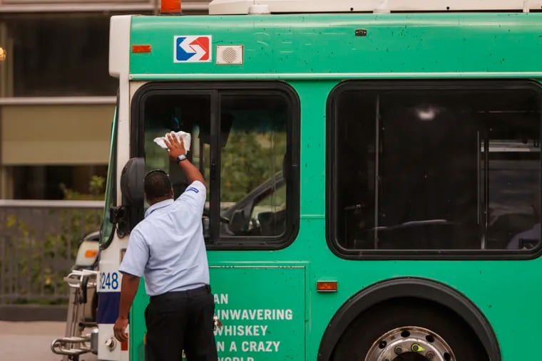 SEPTA bus operator wipes down windows of bus on Monday, August 14, 2023. SEPTA bus and trolley operators have endured verbal abuse and an increasing number of assaults from riders over the past decade.