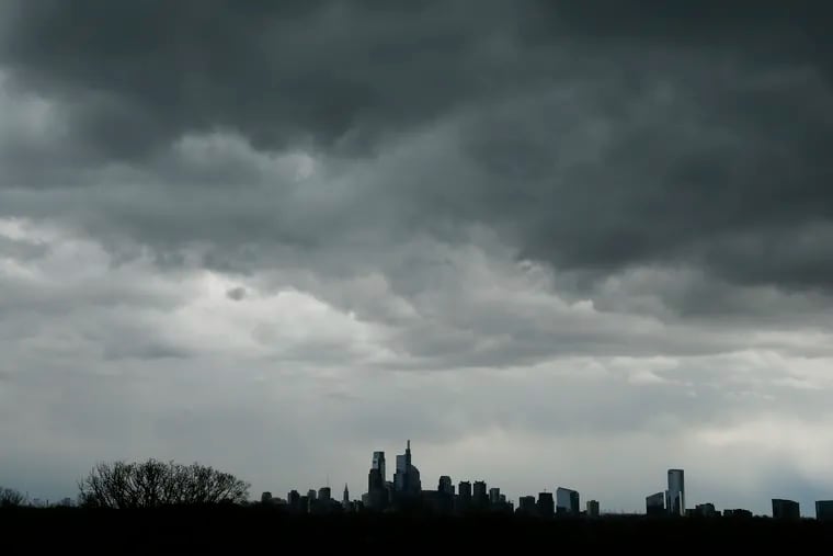 Clouds sit over the skyline of Center City earlier this month. They're about ready for encore Thursday, with a flood watch in effect.