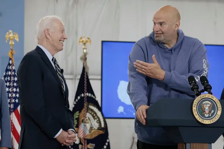 Sen. John Fetterman (D., Pa.) makes President Joe Biden laugh during a 2023 news conference. The Democratic senator this week criticized the president's threat to withhold some arms supplies to Israel.