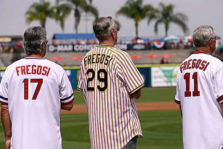 Pete Mackanin, Kent Tekulve and Bobby Knopp wear jerseys of Jim Fregosi. (Charlie Neibergall/AP)