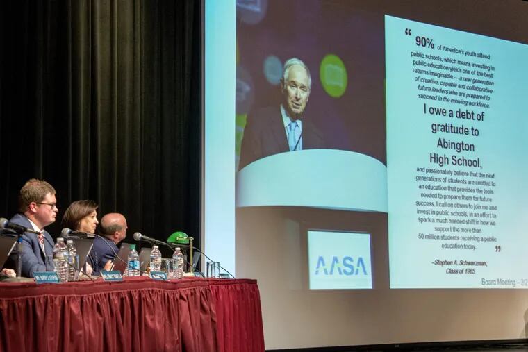 Photo and statement from Wall Street billionaire and Abington High School alum Stephen Schwarzman is projected onstage at a school board meeting April 10, 2018 with residents questioning his $25 million donation, TOM GRALISH / Staff Photographer