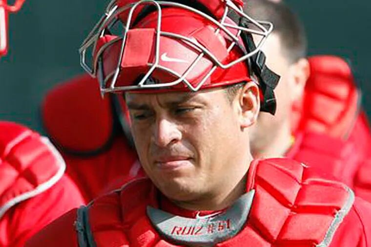 Phillies' catcher's Erik Kratz and Carlos Ruiz walk together off the workout field during Spring Training in Clearwater, FL on Tuesday, February 12, 2013. (Yong Kim/Staff Photographer)