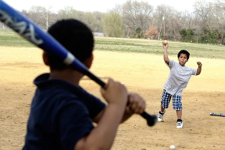 In 2012, Isaiah Gonzalez, 10, pitches to Adrian Woloshin, 8, (both from Camden) At Pyne Point Park in Camden after Camden County officials delivered equipment to North Camden Little League. County officials have also turned parkland into 2 baseball fields for the league to play. ELIZABETH ROBERTSON / Staff Photographer, file
