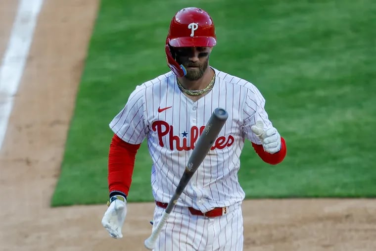 Phillies’ Bryce Harper strikes out swinging in the last out of the eighth inning.
