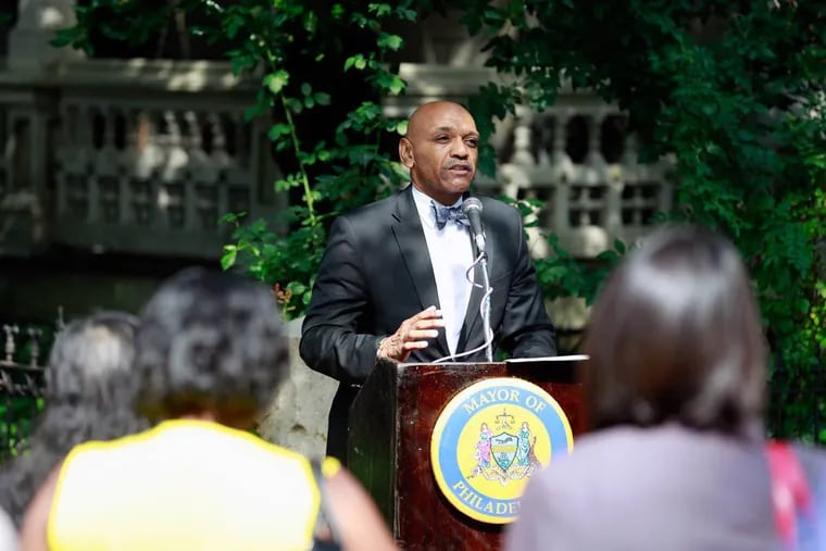 The Rev. Jay Broadnax, president of the Black Clergy of Philadelphia and Vicinity, speaks during an event in which the 3600 block of Hamilton Street was renamed "In-Ho Oh Memorial Way" on Friday, July 29, 2016.