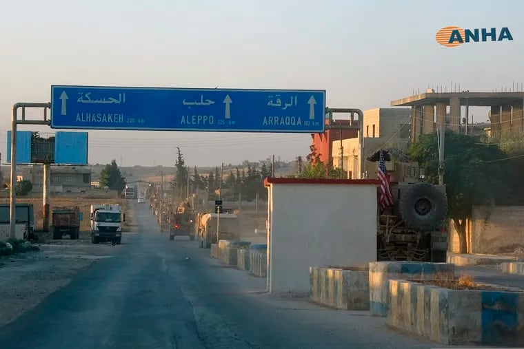 In this image provided by Hawar News Agency, ANHA,  a line of U.S. military vehicles travel down a main road in northeast Syria, Monday, Oct. 7, 2019. U.S.-backed Kurdish-led forces in Syria said American troops began withdrawing Monday from their positions along Turkey's border in northeastern Syria, ahead of an anticipated Turkish invasion that the Kurds say will overturn five years of achievements in the battle against the Islamic State group. (ANHA via AP)