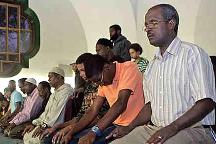 Prayers were offered at the Association of Islamic Charitable Projects in West Philadelphia on Thursday. Ramadan will last until Sept. 19. (Ron Tarver / Staff)