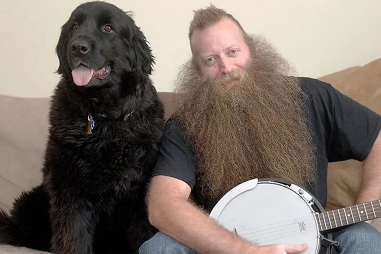 Jeff Langum, 39, the winner of the World Beard Championship, and his pet Newfoundland dog "Abby" at his Voohees, NJ home on Jan. 28, 2014. ( AKIRA SUWA  /  Staff Photographer )