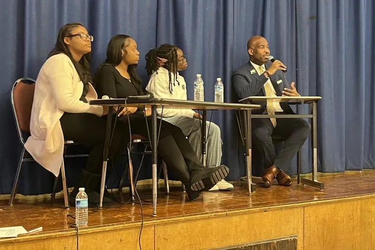 Mayoral candidate Derek Green answers questions alongside students from Paul Robeson High School in West Philadelphia.