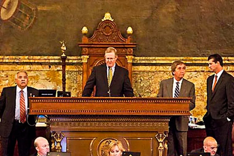 Parliamentarian Clancy Myer (second - standing - from right), with House Speaker Sam Smith at the podium, responds to questions from staff during the budget debate last week. (Photo: State house hand out)