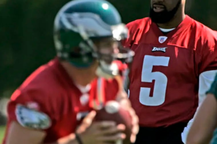 The Eagles&#0039; healing Donovan McNabb looked on as rookie quarterback Kevin Kolb, the team&#0039;s top draft pick, took a snap at the weekend minicamp.