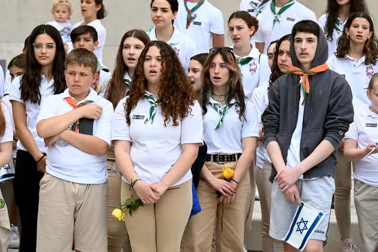 Members of the Tzofim Tzabar Israel Scouts join others in singing the Hatikvah, the national anthem of Israel,