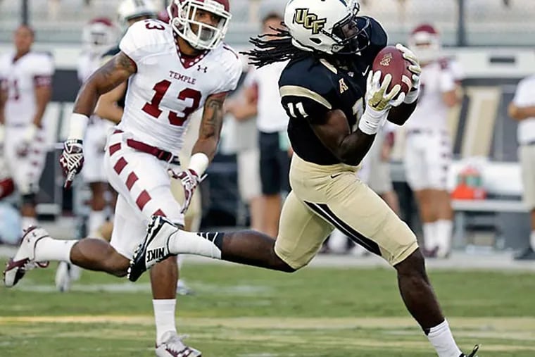 Central Florida wide receiver Breshad Perriman (11) makes a reception for a 54-yard touchdown as he gets past Temple defensive back Nate L. Smith (13) in the first half of an NCAA college football game in Orlando, Fla., Saturday, Oct. 25, 2014. (John Raoux/AP)