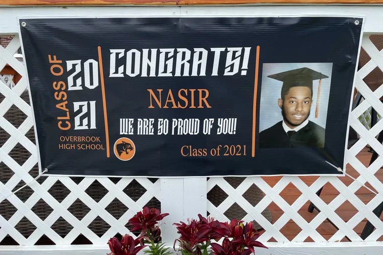 A banner hangs outside the home of 18-year-old Nasir Marks, who was killed Tuesday night in West Philadlephia.