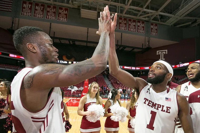 Temple's Quenton DeCosey (left) and Josh Brown celebrate beating Tulsa.