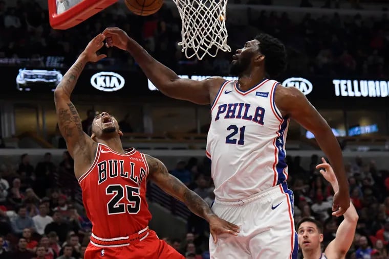 Joel Embiid defends against the Bulls' Walt Lemon during the Sixers' win on Saturday in Chicago.