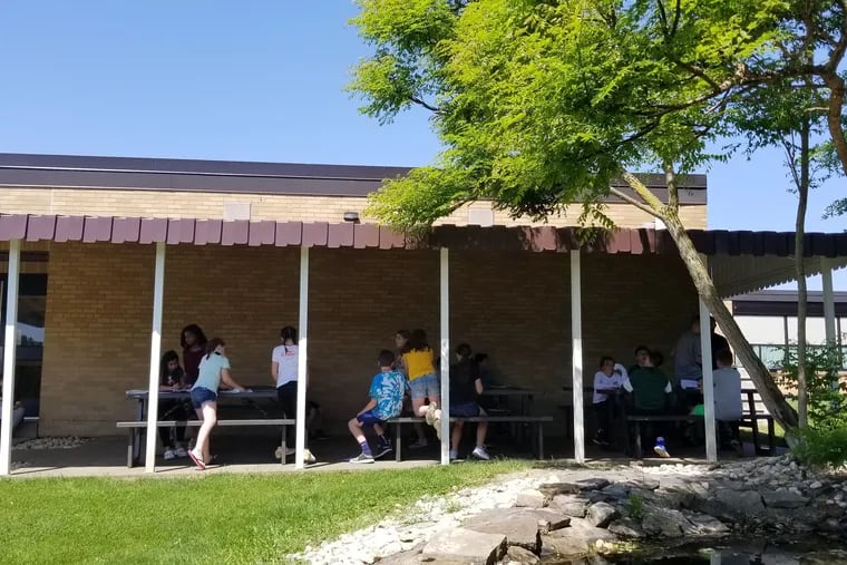 Rostraver Middle School's shade shed, built with a grant from the Pennsylvania Academy of Dermatology, provides shelter from the sun at lunch and recess