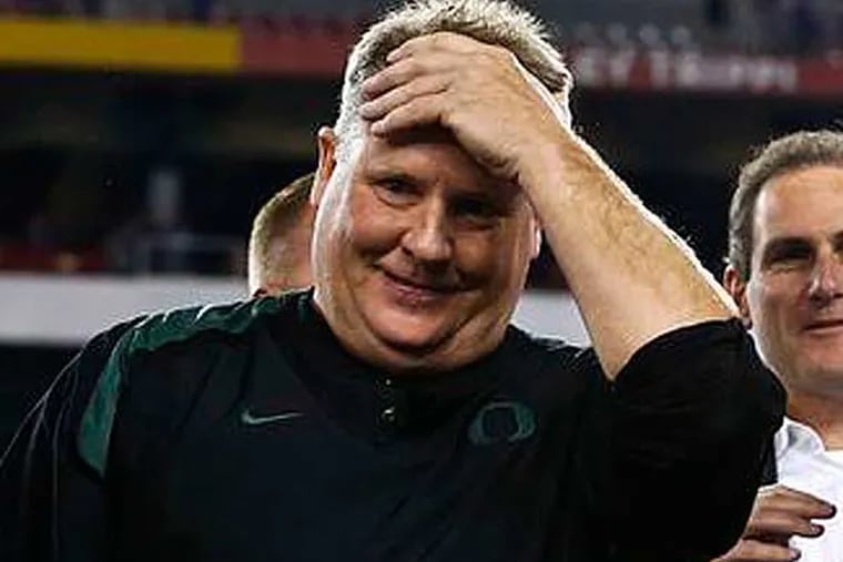Oregon head coach Chip Kelly celebrates a win over Kansas State after the Fiesta Bowl NCAA college football game Thursday, Jan. 3, 2013, in Glendale, Ariz. Oregon defeated Kansas State 35-17. (Ross D. Franklin/AP)