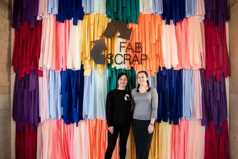 Camille Tagle, co-founder and creative director, and Jessica Schreiber, founder and CEO, posed for a portrait at the new Fabscrap location in the Bok Building in South Philadelphia, on November 15, 2021. Fabscrap is a textile reuse and recycling company.