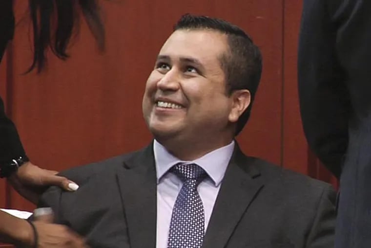 In this image from video, George Zimmerman smiles after a not guilty verdict was handed down in his trial at the Seminole County Courthouse, Sunday, July 14, 2013, in Sanford, Fla. (AP Photo/TV Pool)