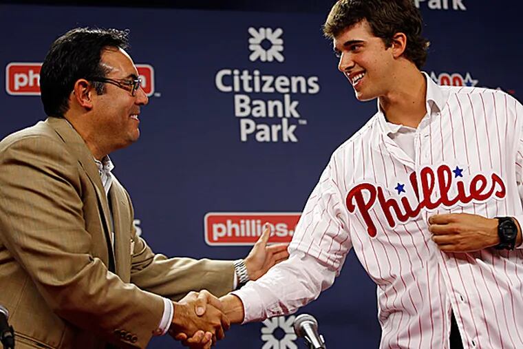 Phillies general manager Ruben Amaro Jr. and 2014 first round draft pick Aaron Nola. (Matt Slocum/AP)