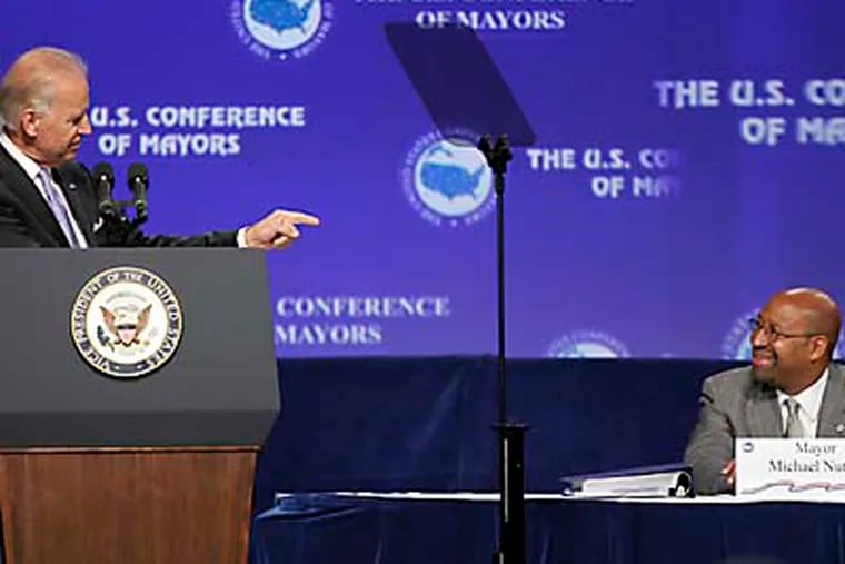 Vice President Joe Biden acknowledges Philadelphia Mayor Michael Nutter before speaking at the Annual Meeting of the U.S. Conference of Mayors, Friday, June 15, 2012, in Orlando, Fla. (AP Photo/John Raoux)