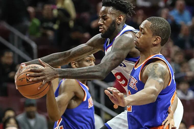 Sixers' JaKarr Sampson grabs a loose ball between  Knicks' Langston
Galloway and Lance Thomas during the first quarter at the Wells Fargo
Center in Philadelphia, Friday, March 20, 2015. (Steven M. Falk/Staff Photographer)