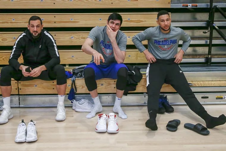 Sixers guard Marco Belinelli, forward Ersan Ilyasova and guard Ben Simmons prepare for team practice at Harvard University on Tuesday.